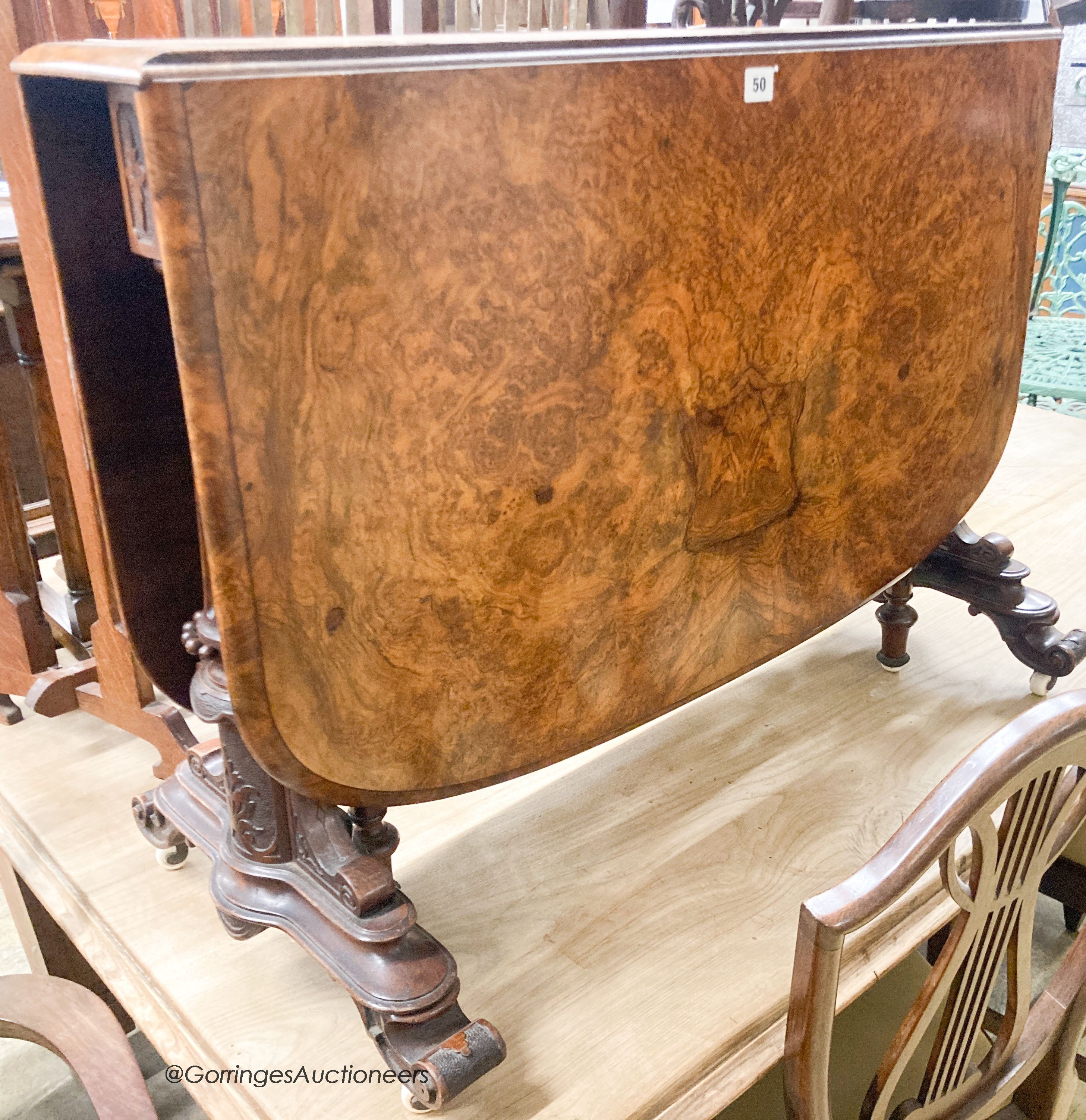 A Victorian burr walnut Sutherland table. 120cm extended, H-66cm.
